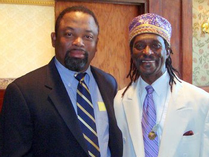 Associate Professor Charles Thomas (right) received an award from the SI Branch of the NAACP.