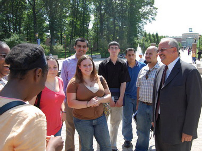 CSI President Dr. Tomás D. Morales, right, chats with students on the school’s campus in Willowbrook