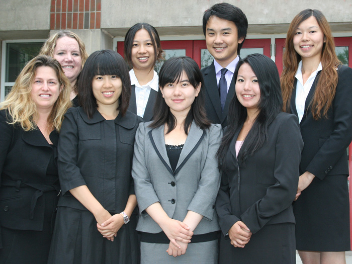 Victoria Cox and Barbara Clark (far left) pose with the six City University of Hong Kong students.